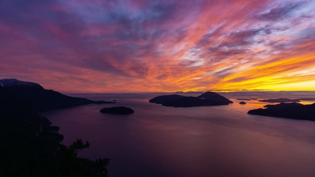 Time Lapse of Tunnel Bluffs Hike, in Howe Sound, North of Vancouver, British Columbia, Canada. Panoramic Canadian Mountain Landscape View from the Peak during sunny winter sunset. 4k