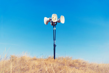 in the field on the ground is a loudspeaker
