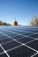 Close shot of a solar panel installation on a rooftop, in vertical format