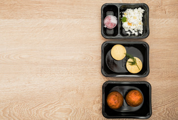 Healthy food delivery. Take away food for diet in plastic boxes. Top view, flat lay.
