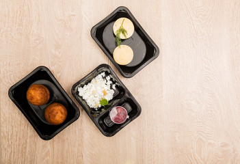 Healthy food delivery. Take away food for diet in plastic boxes. Top view, flat lay.