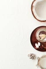 Obraz na płótnie Canvas Coconut cosmetics background. Top view