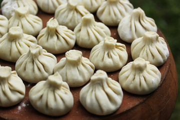 National Georgian cuisine. Khinkali on the pottery. Georgian food