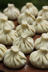 National Georgian cuisine. Khinkali on the pottery. Georgian food