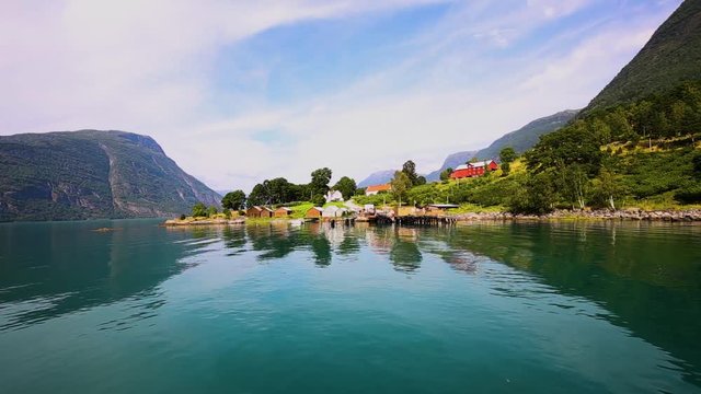 View on Ornes, famous for Urnes Stave Church, from the liitle ferry crossing Lustrafjorden between Solvorn and Ornes in Sogn og Fjordane county in Norway.