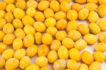 yellow fresh ripe plums placed on table in market. Vegetarian or healthy eating.