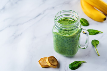 Spinach banana smoothies in glass