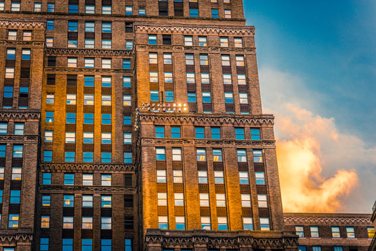 Windows on a facade at warm golden light of sunset