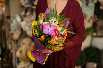 Close-up of colorful bouquet in female's hands