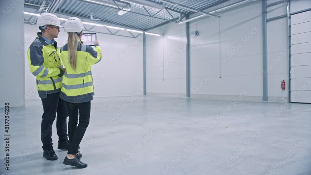 Poster Industry 4.0 Modern Factory: Two Engineers Use Digital Tablet Computer with Augmented Reality Software Visualizing of Manufacturing Plant Room Mapping, Factory Layout. Illustrative Mock-up Concept