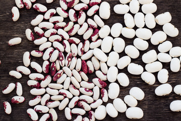 Beans (beans). Background from multi-colored beans. Wood texture
