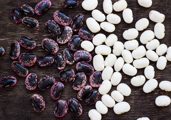 Beans (beans). Background from multi-colored beans. Wood texture