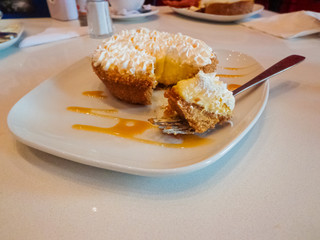 Taking a piece of lemon pie with a fork