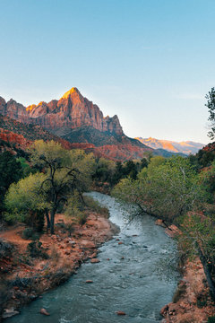 River flowing in a rocky landscape with mountains in the background