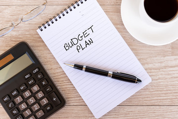 Business finance Concept - Business plan text on note pad