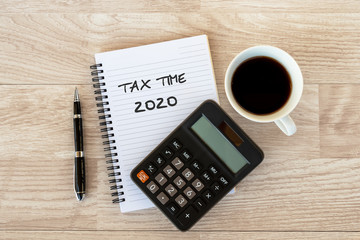 Business finance Concept - Tax time 2020 text on Note pad