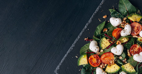 heart-shaped mozzarella vegetarian salad with avocado, tomato and nut sauce