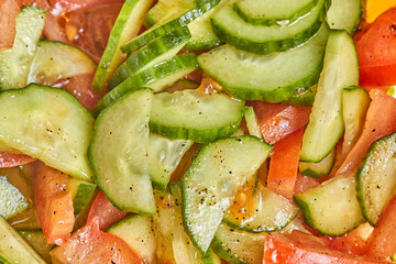 Fresh tomato and cucumber salad close up photo