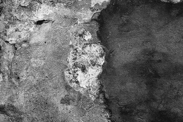 Texture of a concrete wall with cracks and scratches which can be used as a background