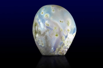 Beautiful blue agate gemstone on dark background
