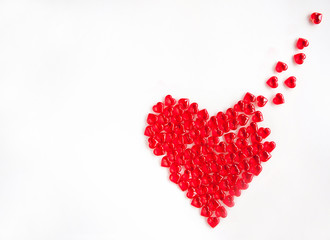 A large red heart made of small hearts on a white background. The concept of Valentine's day. The concept of love