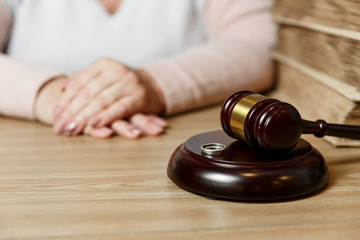 Hands of wife, husband signing decree of divorce, dissolution, canceling marriage, legal separation documents, filing divorce papers or premarital agreement prepared by lawyer.