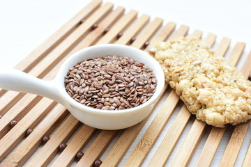  Natural sesame seeds on wooden background