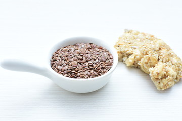  Natural sesame seeds on wooden background