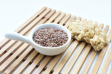  Natural sesame seeds on wooden background