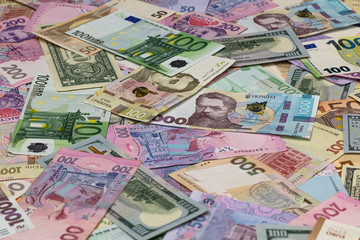 Closeup of dollar, euro and hryvnia banknotes 