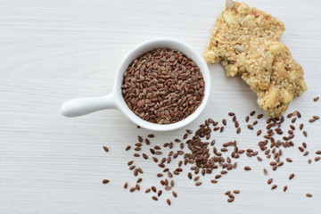 Natural sesame seeds on wooden background