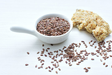  Natural sesame seeds on wooden background