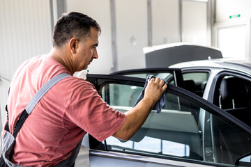 Fototapeta premium Car cleaning and preparation at a car service
