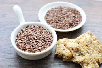  Natural sesame seeds on wooden background