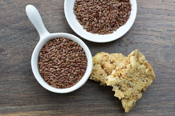  Natural sesame seeds on wooden background