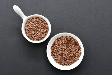  Natural sesame seeds on wooden background