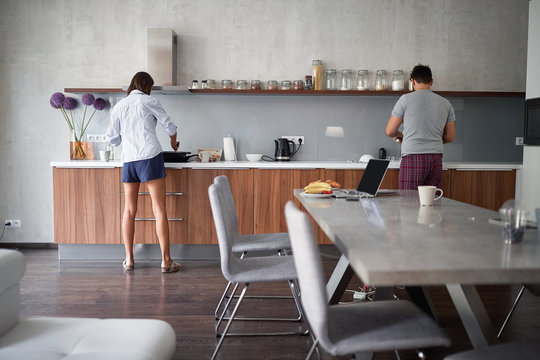 young couple preparing breakfast in the morning in  kitchen