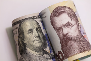 100 dollar and 1000 hryvnia banknote. Franklin and Vernadskyi confrontation