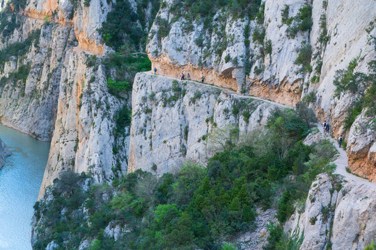 Hiking, Path carved on the rock, Montrebei Gorge - Congost de Mont-rebei, Noguera Ribagorzana river, Montsec Range, The Pre-Pyrenees, Lleida, Catalonia, Spain, Europe