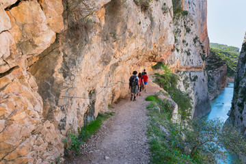 Hiking, Path carved on the rock, Montrebei Gorge - Congost de Mont-rebei, Noguera Ribagorzana river, Montsec Range, The Pre-Pyrenees, Lleida, Catalonia, Spain, Europe