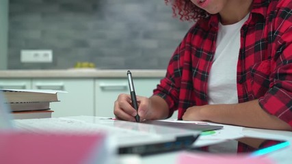 Creative teen girl drawing on graphics tablet connected to laptop, design hobby - Powered by Adobe