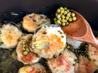 Stuffed fresh artichokes with green peas