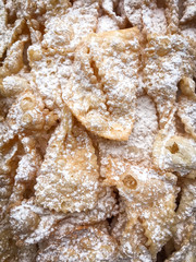 Fototapeta na wymiar Delicious fried chiacchiere, an Italian traditional pastry to celebrate carnival