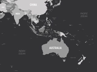 Australia and Southeast Asia map - grey colored on dark background. High detailed political map of australian and southeastern Asia region with country, capital, ocean and sea names labeling