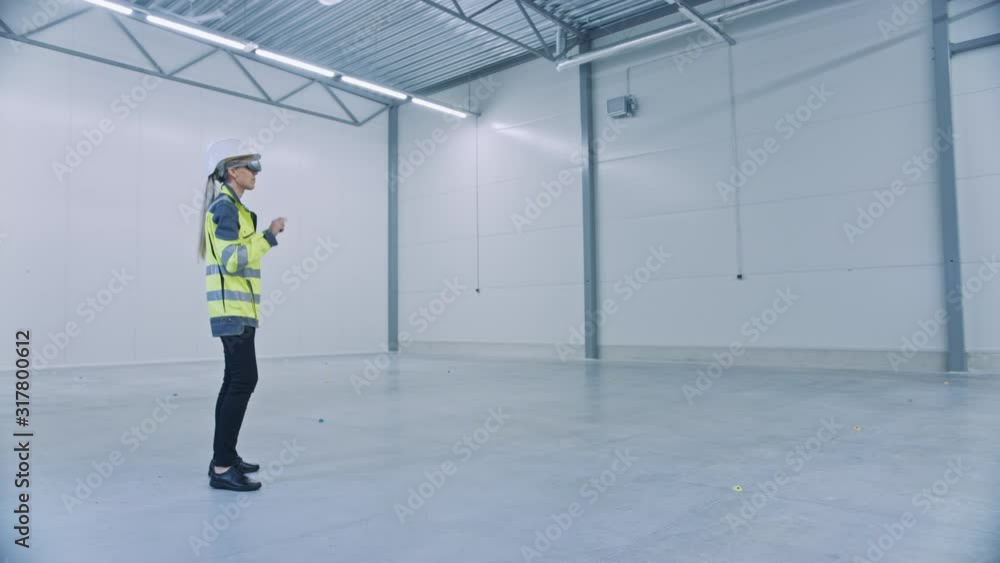 Poster industry 4.0 modern factory: female engineer wearing augmented reality headset uses mixed reality so