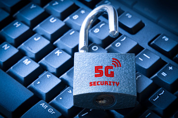 5G mobile network security concept open padlock on the computer keyboard.