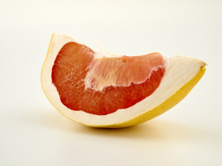 Fresh and juicy pomelo and its slices.Isolate on a white background