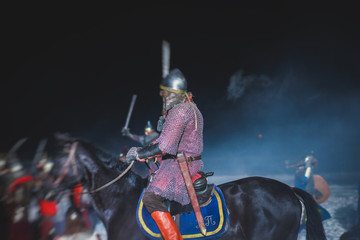 Medieval battle scene with cavalry and infantry, fight between crusaders and knights during...