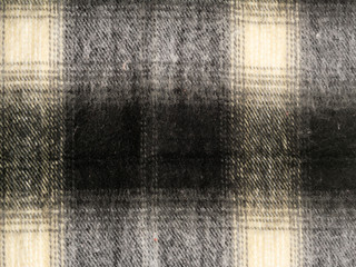 Close-up of background is checkered in brown and black in Scottish style.