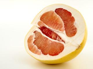 Fresh and juicy pomelo and its slices.Isolate on a white background